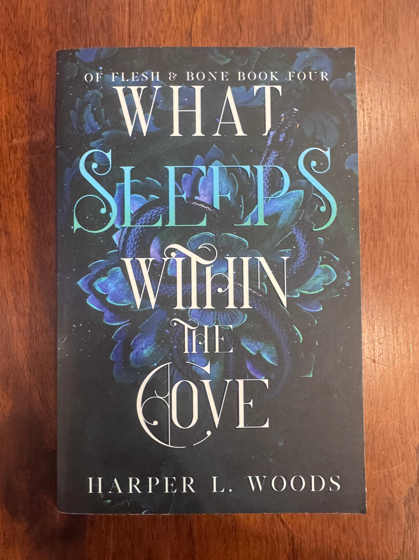 What Sleeps Within the Cove. Harper L. Woods. 2025.