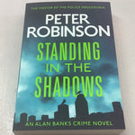 Standing in the Shadows. Peter Robinson. 2023.